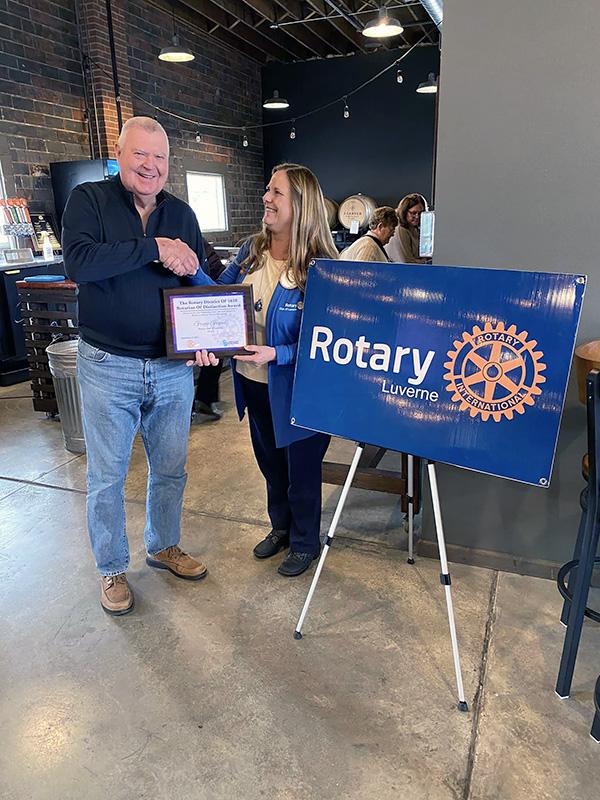 Gregg Gropel of Luverne is presented with the Rotary District 5610 “Rotarian of Distinction” recently by fellow member Karen Willers. The district consists of 39 clubs. Submitted Photo