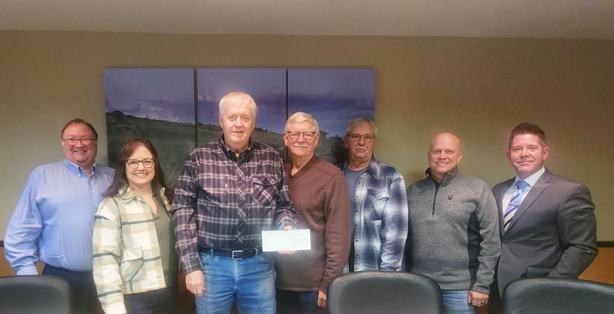 Rock County Commissioners accepted a $10,000 donation from Sioux Valley Energy and Basin Electric Power Cooperative toward installation of new playground equipment at Kanaranzi Park in 2026. Pictured from left are County Administrator Kyle Oldre, commissioners Sherri Thompson, Gary Overgaard, Greg Burger, Stan Williamson and Jody Reisch and Sioux Valley Energy representative Brandon Lane.Mavis Fodness/Rock County Star Herald Photo