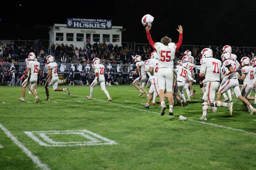 Luverne players rush the Huskies’ field after beating Jackson County Central 36-30 in Week 7 action.