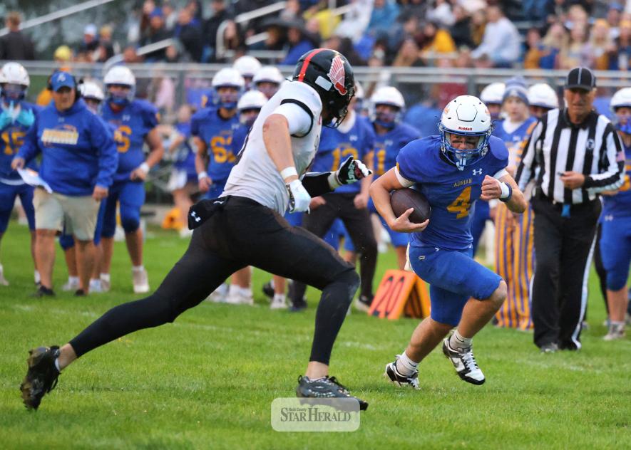 Greg Hoogeveen photo/A-EFB1 Adrian-Ellsworth running back junior Jackson Jenniges finds a lane along the sidelines against Edgerton at home Friday, Sept. 25. The Dragons beat the Flying Dutchmen 22-20 in the homecoming game. Jenniges finished with 105 rushing yards and one TD.