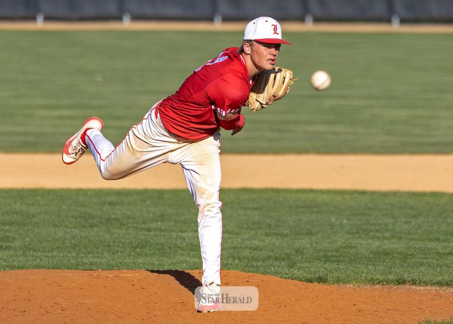 Greg Hoogeveen photo/lhsbaseball1 LHS senior Josh Hansen sends a pitch to the plate against St. James May 7 in Luverne. Hansen got the win in Game 2 on the road.