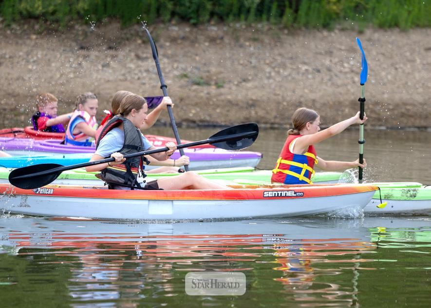 Greg Hoogeveen photo/DLT1 Left: Competitors in the Minnow race take off in kayaks in the first of a three legs in the 2026 Davis Lake Triathlon July 4 at The Lake in Luverne. The second leg was biking followed by running in the third leg that finished back at The Lake.