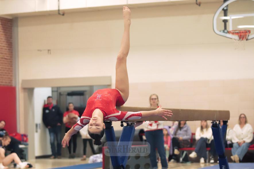Cardinal seventh-grader Marrs Thone strikes a pose during her beam routine in Luverne Friday, Dec. 20. Luverne beat New Ulm 133.950 – 129.200 in the meet.