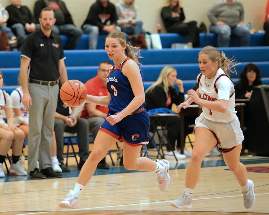 Senior Brynn Rauk dribbles the ball up the court against Red Rock Central Friday, Dec. 1, in Hills. The Hills-Beaver Creek Patriots beat the Falcons 62-15 in their season opener.