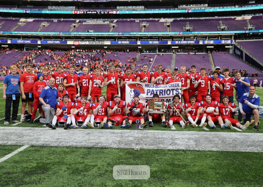 The Hills-Beaver Creek Patriots won the 2025 9-player State Championship Saturday, Nov. 22, in the U.S. Bank Stadium. Pictured are (front, left) Bode Kruger, Callum Bartels, Jacob Wallin, Wyett Shimp, Gavyn Leuthold, Riggins Rheault, Eduardo Wegener, Micah Bush, Jamin Metzger, Quintice Susie, coach Chris Harnack, (second row) head coach Rex Metzger, Jack Kruger, (back) managers Huck Terry, Briggs Metzger, Noah Engelkes (blue hat on), Cash Wilsey, Camdyn Broesder, Malachi Bush, coach Jason Rauk (behind #1), 