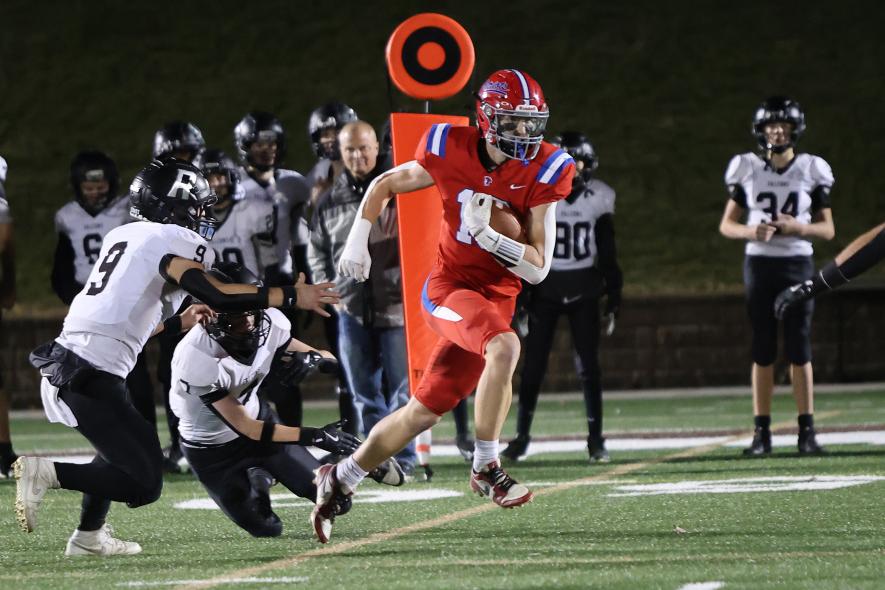 H-BC sophomore wide receiver Brodie Metzger breaks away from several Falcons defensemen as he heads for the end zone Nov. 6 in the 9-player state quarterfinals in Marshall. The Patriots won the game 44-14, and Metzger collected two touchdowns in the game.