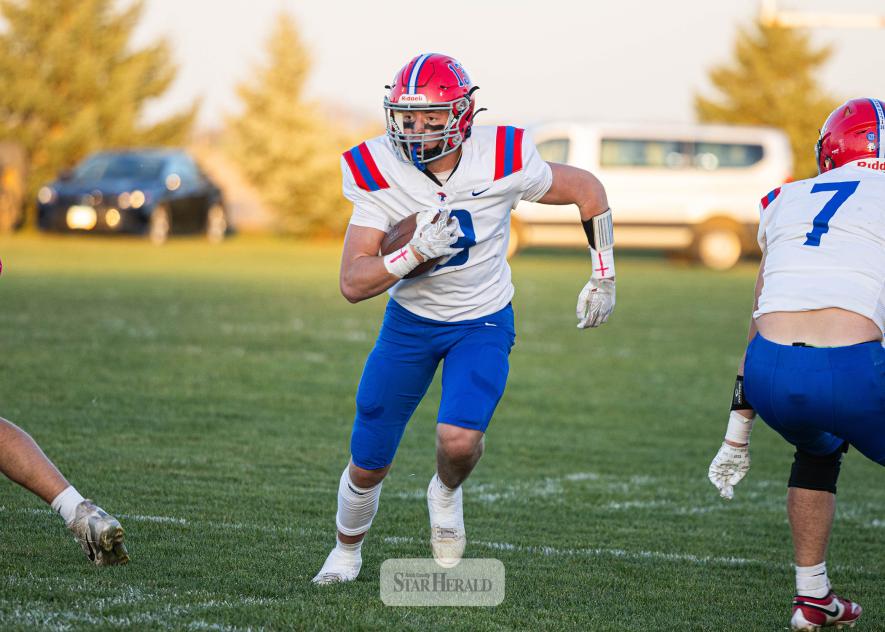 Samantha McGaffee photo/HBCFB1 Patriots junior Max Sammons runs through a hole in the Cougars defense Oct. 20 in Cedar Mountain. H-BC won 46-0.