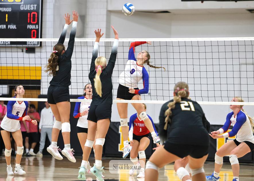 Greg Hoogeveen photo/HBCVB1 Patriots senior Ava Steinhoff prepares to spike the ball against Westbrook-Walnut Grove with teammates ready for any deflections at home Thursday, Oct. 8. The Chargers won the match against H-BC in three sets. 