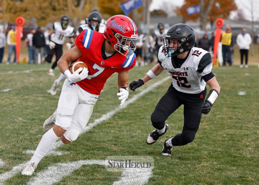 Junior Micah Bush cuts to the sideline against an Alden-Conger defensive player. Bush finished with 105 yards and one touchdown in H-BC’s section semifinal 50-6 victory Saturday, Oct. 26, at home.