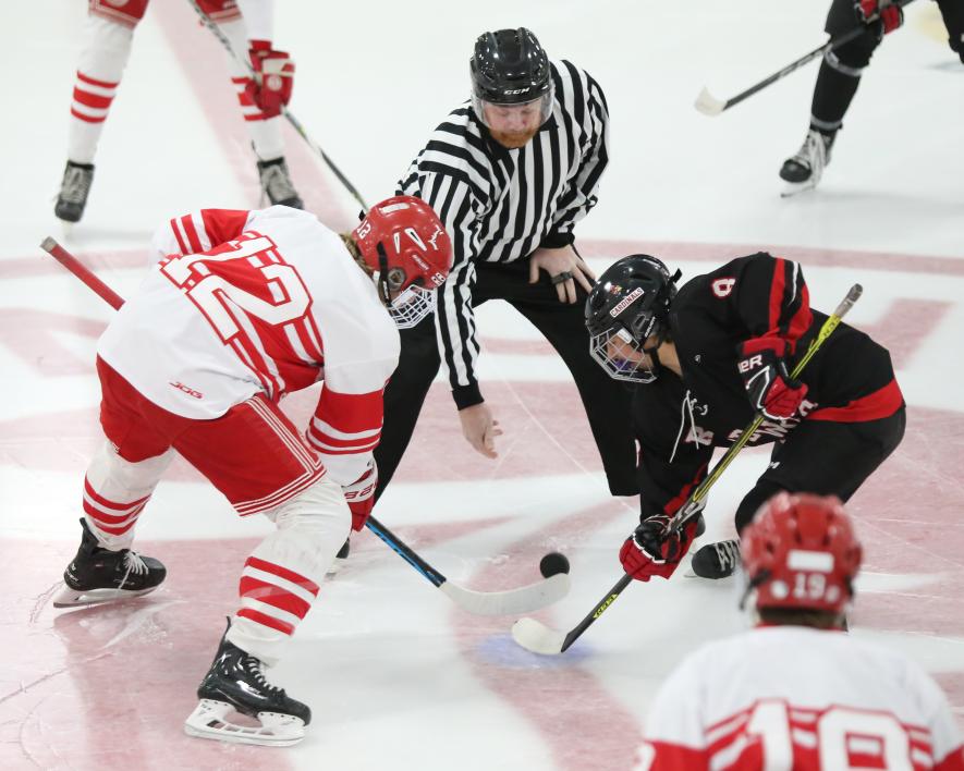 Senior Elliot Domagala takes the opening faceoff against Redwood Thursday, Jan. 11, in Luverne.The Cardinals won the game 14-0. Luverne is now 13-0 for the regular season.