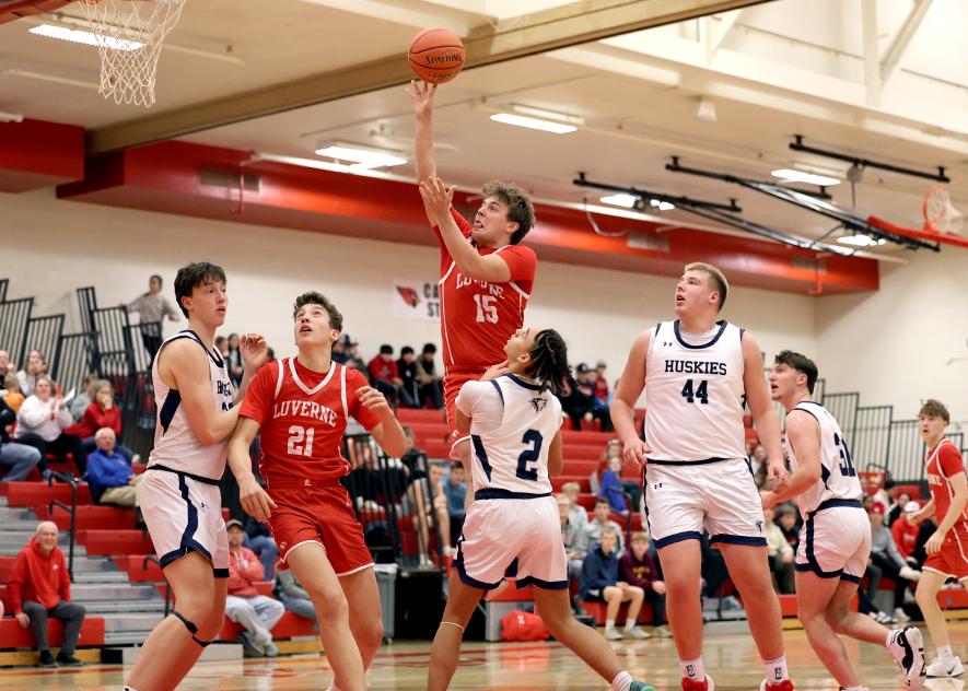 Greg Hoogeveen photo/LHS BBB1 LHS junior Kayne Jurrens goes to the air for a basket against Jackson Dec. 9 at home. The Cardinals beat the Huskies 75-61 in the game.