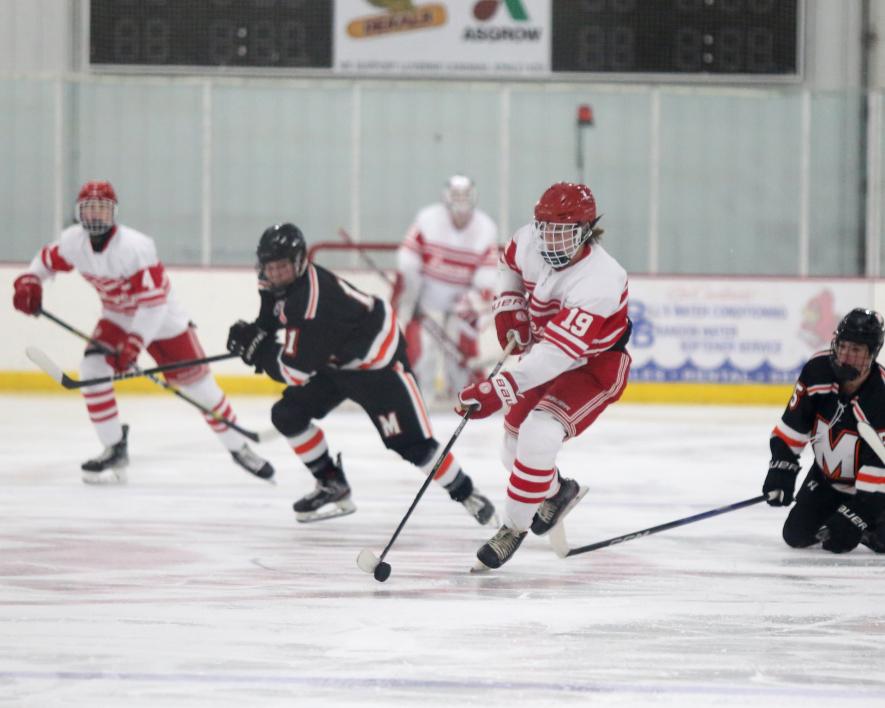 Senior Patrick Kroski splits the Marshall defense as he heads toward their goal in Luverne Tuesday, Nov. 28. The Cardinals pulled off an exciting 2-1 win in overtime in their season opener game.