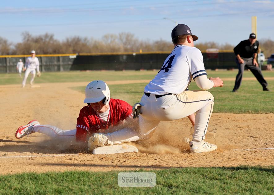 Greg Hoogeveen photo/LHSBB1 Luverne senior Maddux Domagala successfully steals third base against Jackson County Central at Redbird Field Tuesday, April 14. The Cardinals beat the Huskies 16-6 by a 10-run rule in the fifth inning of the game.