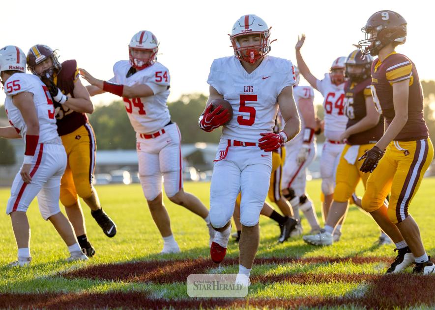 Greg Hoogeveen photo/0910 LHSfootball1 LHS senior Matthew Gangestad, No. 5, breaks through the Blue Earth defense for Luverne’s first touchdown of the season. LHS beat the Bucanneers 41-0 in the game.