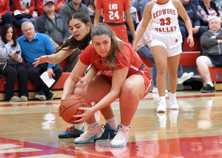 Greg Hoogeveen photo/LHSGBB2 Luverne senior Ava Sieve fights for control of the ball under the hoop with a Redwood Valley player Friday, Dec. 19, in Luverne. LHS easily won the game 78-25 against Redwood Valley.