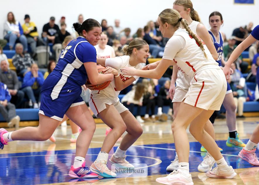 Greg Hoogeveen photo/LHSGBB3 LHS senior Jenna Bullerman fights for a loose ball with an Adrian-Ellsworth player Dec. 22 on the road. Bullerman had three rebounds and one steal in the 75-61 win over the Dragons.