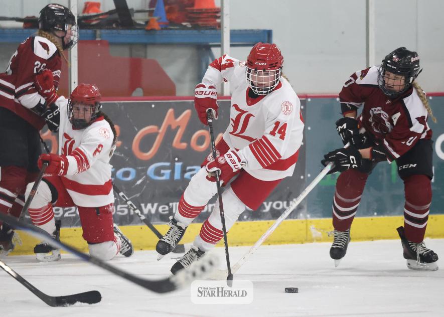 Greg Hoogeveen photo/LHSGHOC1 Luverne Cardinal girls’ hockey freshman Cynthia Rogers works the puck past a Fairmont defensive player on home ice Tuesday, Jan. 20. Rogers had one goal and one assist in the Cardinals 8-0 win.