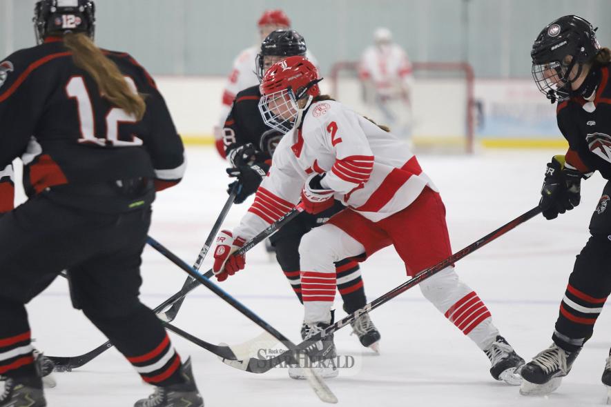 LHS eighth-grader Tenlee Pick gets caught in a pile of Worthington players in front of their goalie. Pick got one assist in the 11-0 win Dec. 10 at home.