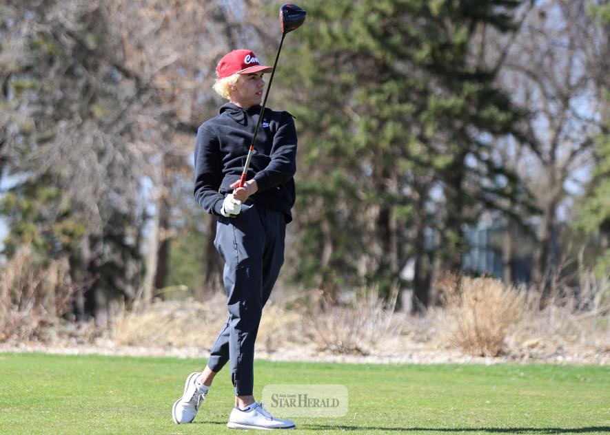 LHS senior Levi Gonnerman watches his drive on hole No. 1 at the Luverne Country Club Tuesday, April 15. Gonnerman took top honors with a low round of 39 against H-BC.