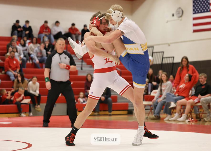 Greg Hoogeveen photo/LHSWRES3 Cardinal junior Hudson Hough tries to take his Adrian opponent to the mat after securing a single leg in the air Tuesday, Jan. 20, at home. Hough lost a 21-6 major decision in the 160-pound weight class. Luverne fell 60-6 to Adrian in the dual.