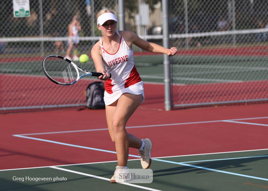 Sophomore Emmery Huiskes runs down a volley against her St. James opponents in exhibition doubles play.  LHS fell 7-0 to St. James in varsity tennis action Thursday, Sept. 11, in Luverne.