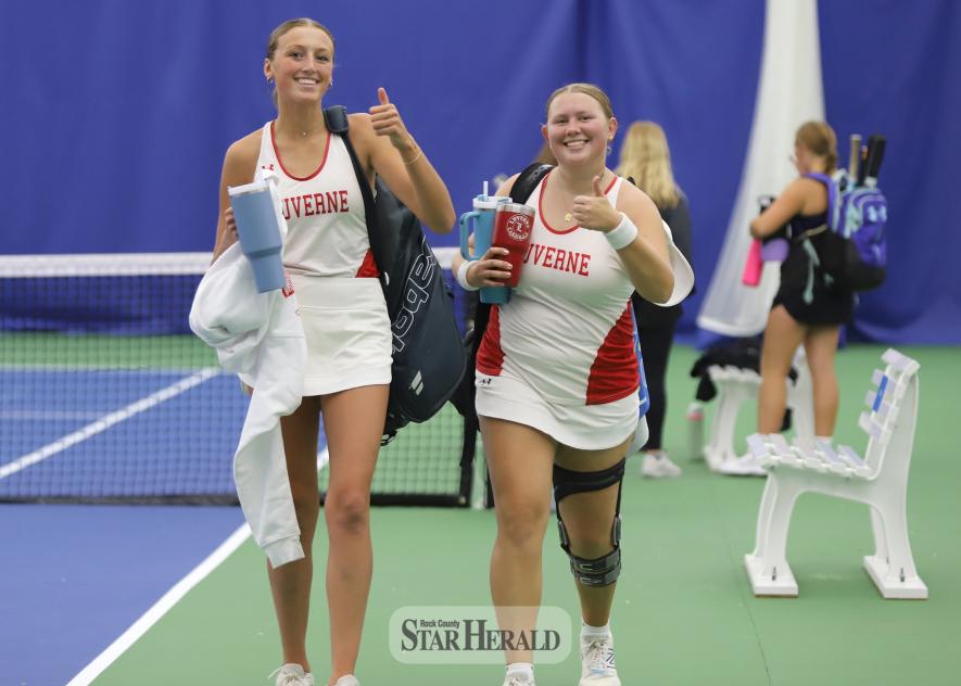 Senior Augusta Papik, left, and Caitlin Kindt give the thumbs up after winning their first doubles match at the individual section play Thursday, Oct. 10, in Sioux Falls. 