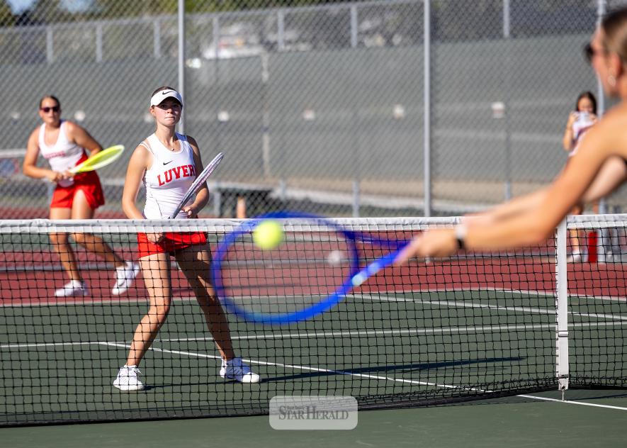 Greg Hoogeveen photo/0924LHSTennis1 LHS sophomore Makenzie Smith, foreground, and eighth-grader Ashlyn Hemme prepare for a return by Blue Earth in No. 3 double action in Luverne Sept. 15. 