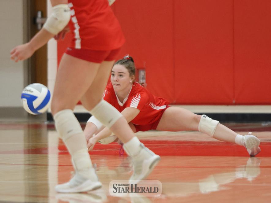 Junior Bernie Rock crouches to make a dig against St. James Thursday, Sept. 26, in Luverne. The Cardinals beat the Saints 3-0 in the game.