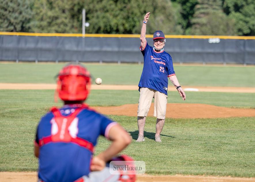 Greg Hoogeveen photos Below: Betty Mann throw out the first pitch to catcher Braydon Ripka to open the game.