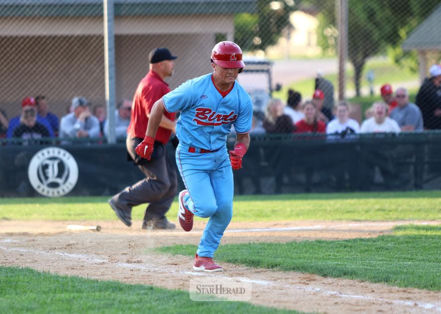 Redbird catcher Braydon Ripka sprints to first base after hitting a low bouncing ball toward third base Sunday, June 8, in Luverne. The Redbirds fell 5-2 in the game.