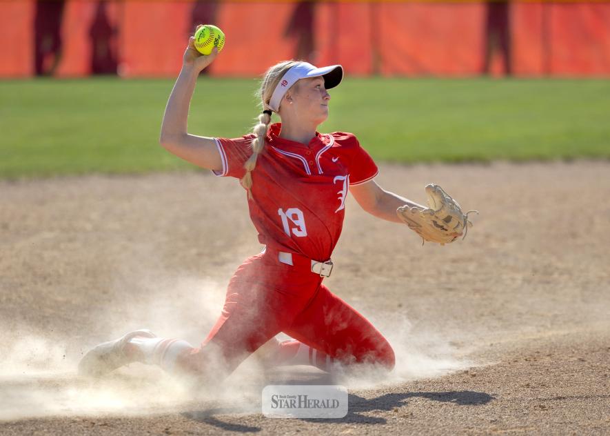 Greg Hoogeveen photo/softball1 LHS senior Allie Kracht throws to first base from her knees after diving for a grounder against West Central May 7. Luverne fell 9-7 to West Central in the game.