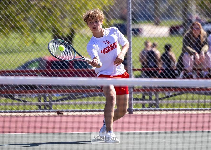 Greg Hoogeveen photo/tennis1 Eighth-grader Hudson Seifert returns a serve against Vermillion May 7.