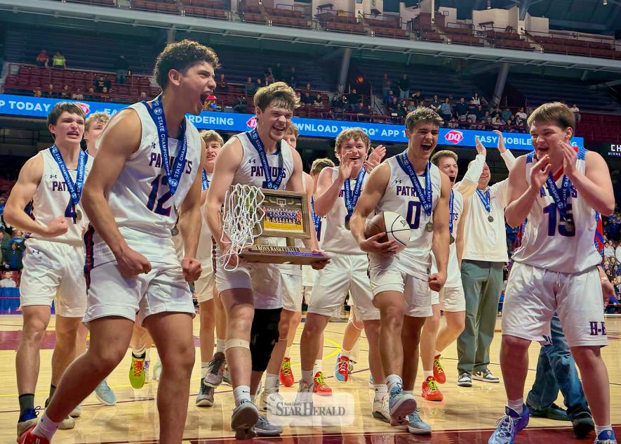  H-BC players celebrate their first-ever Class A boys’ basketball state championship Saturday, March 28, in Williams Arena. The No. 5 seed Patriots took down Southland, the No. 4 seed, 72-69 in the state quarterfinals March 26 at Target Center.  H-BC knocked off the No. 1 seed and undefeated the Henning Hornets March 27 at Williams Arena and demolished the No. 2 seed Janesville-Waldorf-Pemberton Bulldogs 64-33 March 28 in Williams Arena to collect the state title.