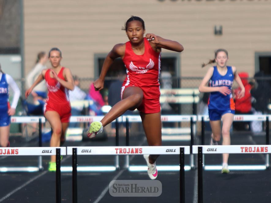 LHS freshman Reinha John hurdles her way to a first-place win in the 300-hurdles Thursday, April 25, in the Worthington track meet. She finished in a personal record time of 48.58.