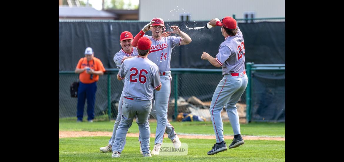Greg Hoogeveen photos/Redbirds1 Redbirds players run onto the field to celebrate after beating Jackson 12-2 in final game of the third place series. Ethan Beyer, No. 24, drove in the final run to seal Luverne’s spot in the 2026 MBA State Tournament. 