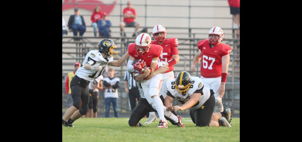 Senior Elliot Domagala carries the ball against Sibley East defense Friday, Sept. 15, in Luverne. Domagala rushed for 55 yards against the Wolverines in the Cardinals’ 35-0 win at home.