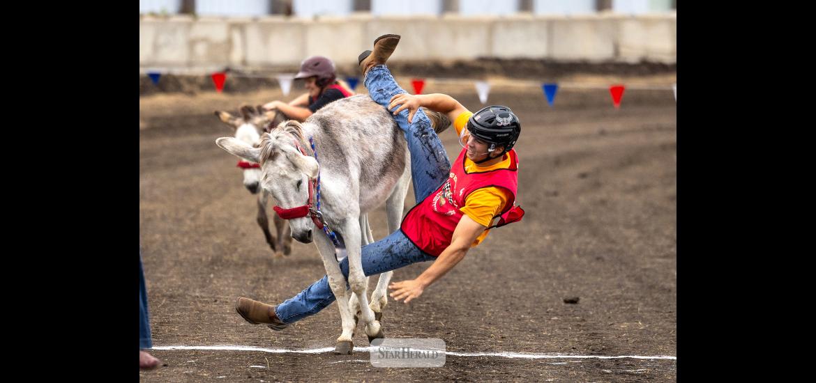 Matthew Gangestad prepares to hit the ground after getting a wild donkey across the finish line July 29.