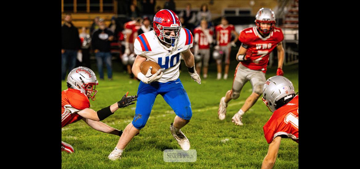 Samantha McGaffee photo/H-BCFB1 H-BC freshman Huck Terry weaves his way through several Chargers players on the road Friday, Sept. 25. H-BC won the game 55-6. Terry rushed for 55 yards and one touchdown.