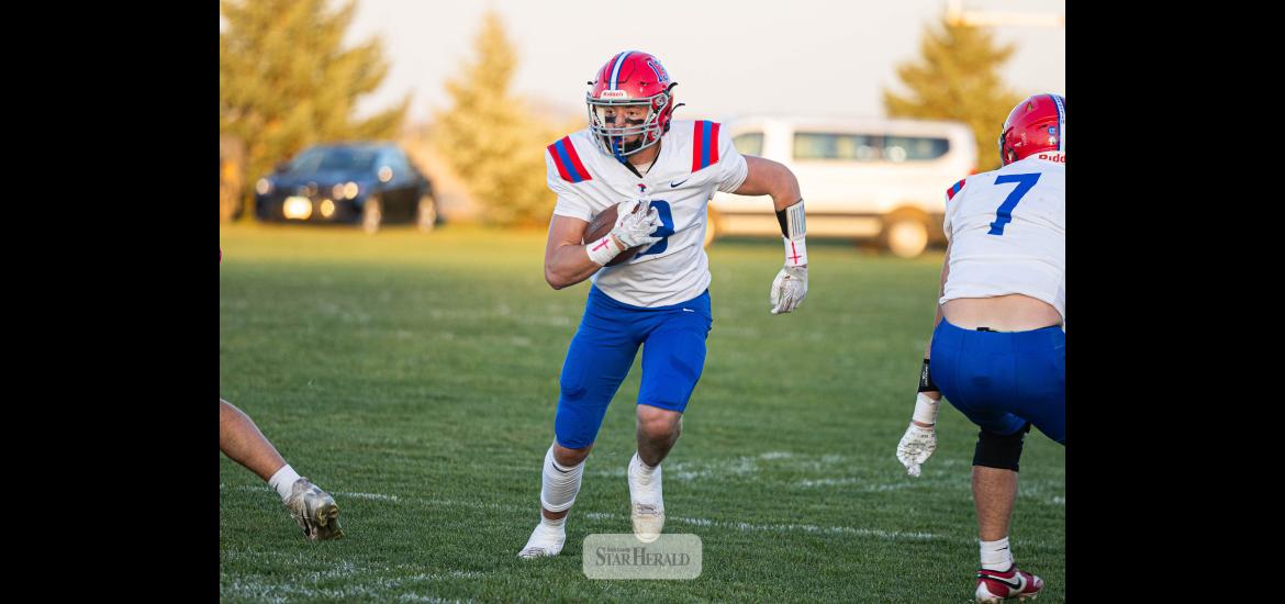 Samantha McGaffee photo/HBCFB1 Patriots junior Max Sammons runs through a hole in the Cougars defense Oct. 20 in Cedar Mountain. H-BC won 46-0.