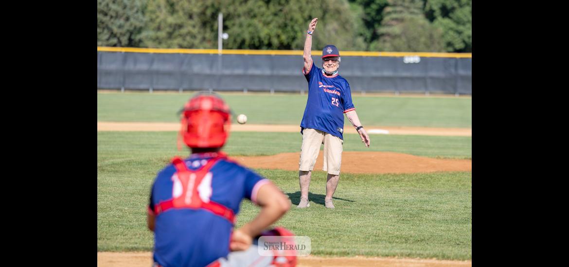 Greg Hoogeveen photos Below: Betty Mann throw out the first pitch to catcher Braydon Ripka to open the game.