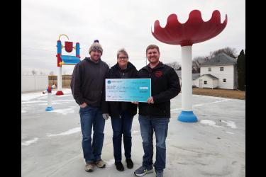 Representatives from the city of Beaver Creek accepted a $7,500 check from Sioux Valley Energy (SVE) Friday morning at the splash park in Beaver Creek. The amount is a combination of $5,000 from SVE Revive 2030 program and $2,500 from SVE Operation Round-Up (See related story). The money will go toward the fundraising campaign to update and expand the Beaver Creek splash pad. Pictured are Beaver Creek public works director Travis Helgeson (left), City Council member Heidi Freese and Mayor Josh Teune. 