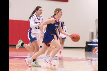 Junior Bailey Spykerboer dribbles past HLOF on her way to the hoop. The Lady Pates beat the Coyotes 51-16 at home Thursday, Feb. 1.