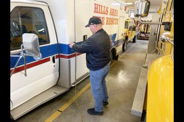 Hills Area Fire Department Chief Jared Rozeboom snaps the electrical cord into place Monday afternoon to the department’s 1996 Ford rescue truck and former ambulance. The rescue truck plays an important role in the department’s emergency calls as a transport of medical equipment and as support for the volunteer firefighters during each emergency call. In 2023 the rescue truck supported the department’s 61 calls. The department has owned the truck since 2011. Mavis Fodness/Rock County Star Herald Photo