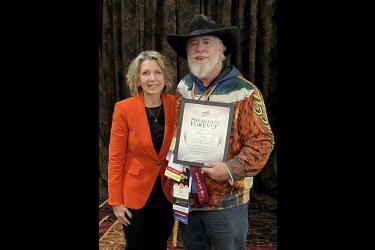 Star Herald Outdoor columnist and 40-year wildlife conservationist Scott Rall earned national recognition Saturday as “Volunteer of the Year” during Pheasant Fest in Sioux Falls. He’s pictured with National Pheasants Forever CEO Marilyn Vetter Saturday afternoon at the Sioux Falls Convention Center.