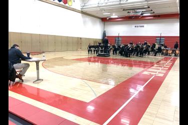 Luverne High School concert band, directed by James Jarvie, plays “The Witch and the Saint” by Steven Reineke for judge John Ginacchio of Marshall (far left) in the high school gymnasium. Other instrumental judges included Mike Peterson, Fulda, and Rick Nicklay, Okoboji, Iowa. Mavis Fodness/Rock County Star Herald Photo