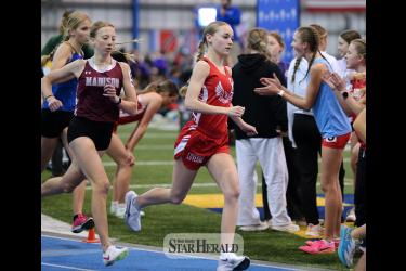 Senior Jenna DeBates focuses on her 1600-meter race Saturday, March 23, in Brookings. She finished in third place after pushing her way toward the front at the end of the race.