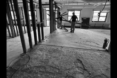 Inmates with Rock Nobles Community Corrections have been working on the former Luverne Armory to get interior rooms ready for the Rock County Land Management Office. Here they are removing tin, wiring and lighting fixtures. Lori Sorenson/Rock County Star Herald Photo