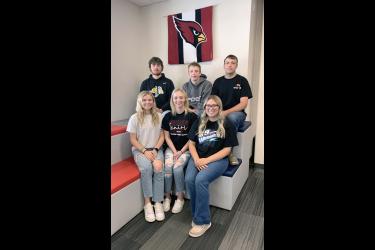 On Sunday three sets of twins will graduate from Luverne High School, the second consecutive year such an event has occurred. Pictured sitting with their twin behind them are (from left) Tori and Will Serie, Josie and Jack Voorhees and Izabel and Samuel Honerman. Mavis Fodness/Rock County Star Herald Photo