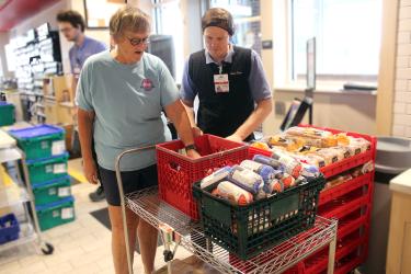 Rock County Food Shelf volunteer Meg Nelson (left) and Kwik Trip store leader John Espe check temperatures Monday morning of the frozen meat being donated to the Food Shelf as part of the Second Harvest Heartland Food Rescue Program. In May, 441 pounds of Kwik Trip donations were distributed. Mavis Fodness/Rock County Star Herald Photo