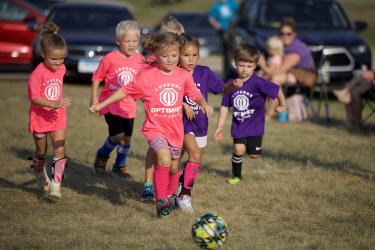 Josie Benson, front center, kicks the ball toward the goal on Aug. 6 in preschool soccer action in Luverne.